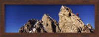 Framed Low angle view of a man climbing up a mountain, Rockchuck Peak, Grand Teton National Park, Wyoming, USA