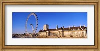 Framed Ferris wheel with buildings at the waterfront, River Thames, Millennium Wheel, London County Hall, London, England