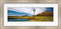 Framed Solitary windmill near a pond, U.S. Route 89, Utah
