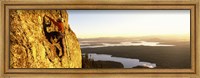 Framed Man climbing up a mountain, Rockchuck Peak, Grand Teton National Park, Wyoming, USA