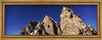 Framed Low angle view of a man climbing up a mountain, Rockchuck Peak, Grand Teton National Park, Wyoming, USA