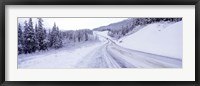 Framed Snow covered road in winter, Haines Highway, Yukon, Canada