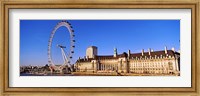 Framed Ferris wheel with buildings at the waterfront, River Thames, Millennium Wheel, London County Hall, London, England