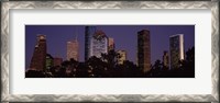 Framed Buildings in a city lit up at dusk, Houston, Harris county, Texas, USA
