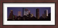 Framed Buildings in a city lit up at dusk, Houston, Harris county, Texas, USA
