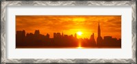 Framed Birght Orange Sky and Sun Behind the New York City Skyline