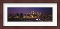 Framed Skyscrapers lit up at dusk, Minneapolis, Minnesota, USA