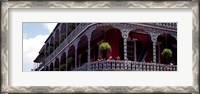 Framed People sitting in a balcony, French Quarter, New Orleans, Louisiana, USA