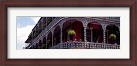 Framed People sitting in a balcony, French Quarter, New Orleans, Louisiana, USA