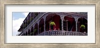 Framed People sitting in a balcony, French Quarter, New Orleans, Louisiana, USA