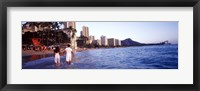 Framed Rear view of a couple wading on the beach, Waikiki Beach, Honolulu, Oahu, Hawaii, USA