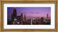 Framed Chicago Buildings lit up at dusk