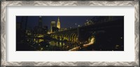 Framed Arch bridge and buildings lit up at night, Cleveland, Ohio, USA