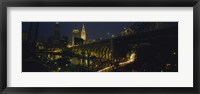 Framed Arch bridge and buildings lit up at night, Cleveland, Ohio, USA