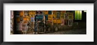 Framed Bicycle leaning against a wall with posters in an alley, Post Alley, Seattle, Washington State, USA