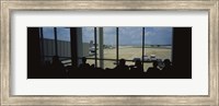 Framed Silhouette of a group of people at an airport lounge, Orlando International Airport, Orlando, Florida, USA