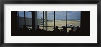 Framed Silhouette of a group of people at an airport lounge, Orlando International Airport, Orlando, Florida, USA