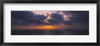Framed Silhouette of a person paragliding over the sea, Blacks Beach, San Diego, California, USA