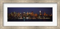 Framed Skyscrapers lit up at night in a city, Manhattan, New York City, New York State, USA