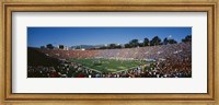 Framed High angle view of spectators watching a football match in a stadium, Rose Bowl Stadium, Pasadena, California
