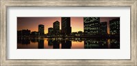 Framed Buildings lit up at dusk, Oakland, Alameda County, California, USA