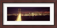 Framed Bay Bridge and San Francisco skyline at night, California