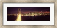 Framed Bay Bridge and San Francisco skyline at night, California