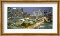 Framed Skyscrapers lit up at night, Houston, Texas