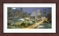 Framed Skyscrapers lit up at night, Houston, Texas