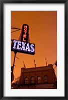 Framed Low angle view of a neon sign of a hotel lit up at dusk, Fort Worth Stockyards, Fort Worth, Texas, USA