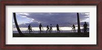 Framed Tourists cycling on the beach, Honolulu, Oahu, Hawaii, USA