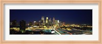 Framed Buildings lit up at night in a city, Minneapolis, Hennepin County, Minnesota, USA