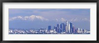 Framed Buildings in a city with snowcapped mountains in the background, San Gabriel Mountains, City of Los Angeles, California, USA