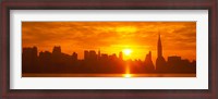 Framed Birght Orange Sky and Sun Behind the New York City Skyline
