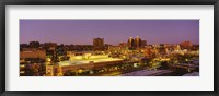 Framed High angle view of buildings lit up at dusk, Kansas City, Missouri, USA