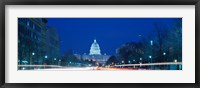 Framed Government building lit up at dusk, Capitol Building, Pennsylvania Avenue, Washington DC, USA