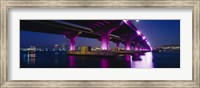 Framed Bridge lit up across a bay, Macarthur Causeway, Biscayne Bay, Miami, Florida, USA