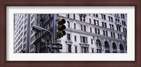 Framed Low angle view of a Green traffic light in front of a building, Wall Street, New York City