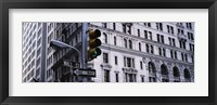 Framed Low angle view of a Green traffic light in front of a building, Wall Street, New York City