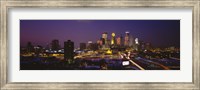 Framed Skyscrapers lit up at dusk, Minneapolis, Minnesota, USA