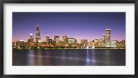 Framed Skyscrapers lit up at night at the waterfront, Lake Michigan, Chicago, Cook County, Illinois, USA