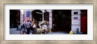 Framed Rear view of three people standing in front of a memorial at a fire station, New York City, New York State, USA