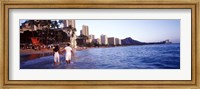 Framed Rear view of a couple wading on the beach, Waikiki Beach, Honolulu, Oahu, Hawaii, USA