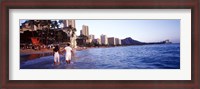 Framed Rear view of a couple wading on the beach, Waikiki Beach, Honolulu, Oahu, Hawaii, USA