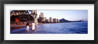Framed Rear view of a couple wading on the beach, Waikiki Beach, Honolulu, Oahu, Hawaii, USA