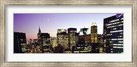 Framed Buildings lit up at dusk, Manhattan