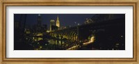 Framed Arch bridge and buildings lit up at night, Cleveland, Ohio, USA