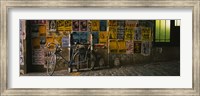 Framed Bicycle leaning against a wall with posters in an alley, Post Alley, Seattle, Washington State, USA