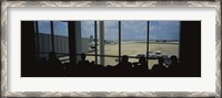 Framed Silhouette of a group of people at an airport lounge, Orlando International Airport, Orlando, Florida, USA