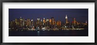 Framed Skyscrapers lit up at night in a city, Manhattan, New York City, New York State, USA